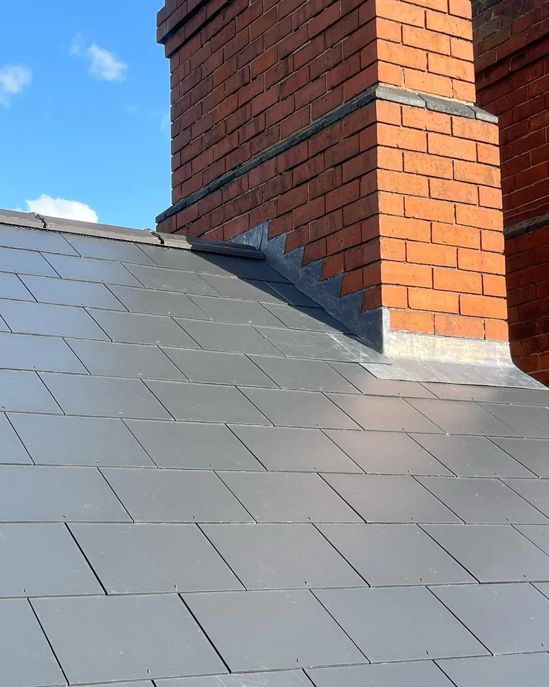 New slates finished against the chimney in Melton Mowbray