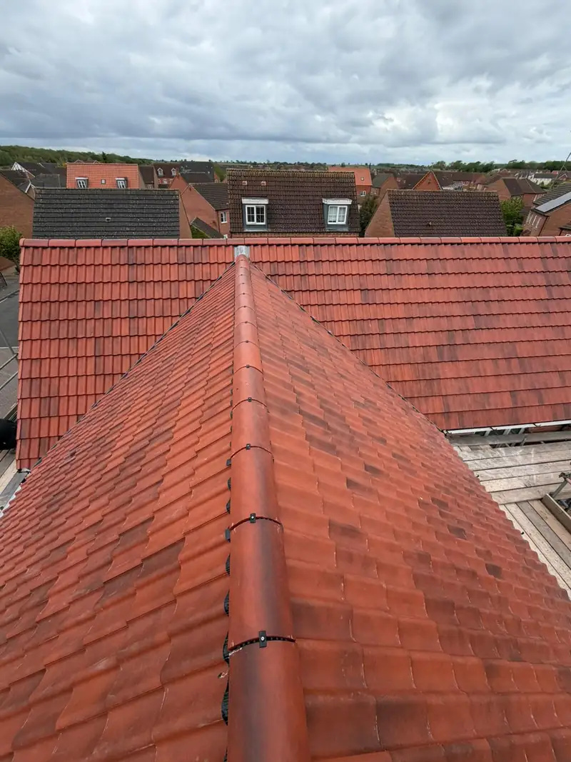 Dry ridge junction where two new roof planes meet on the Bourne re-roof