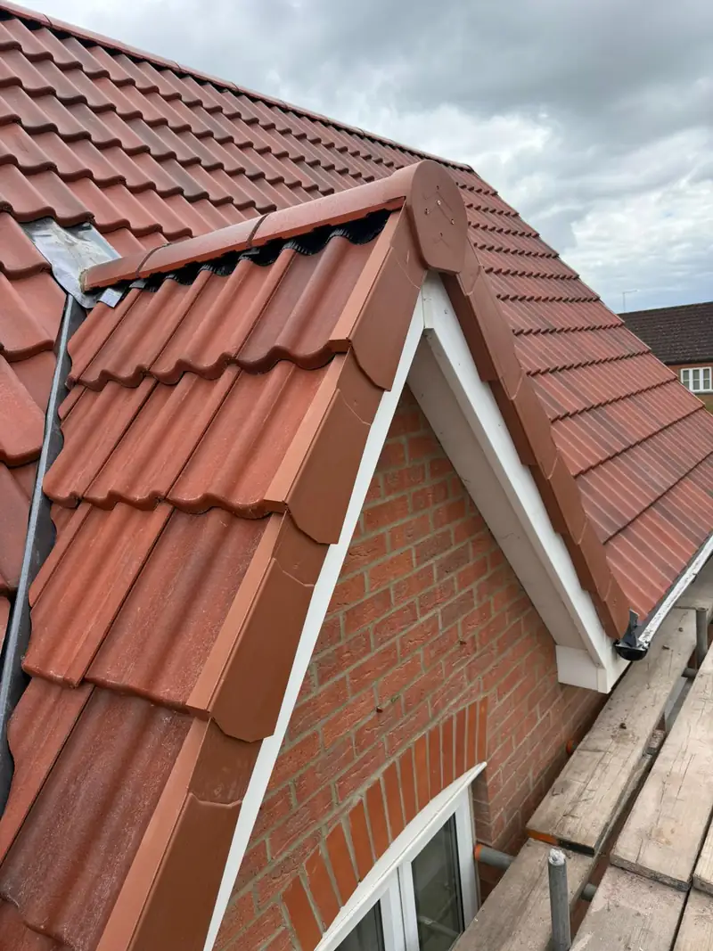Dry verge and ridge end detail with lead flashing on the Bourne re-roof