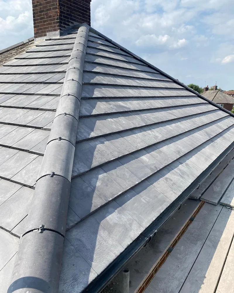 New flat concrete tiles and ridge on a Peterborough re-roof