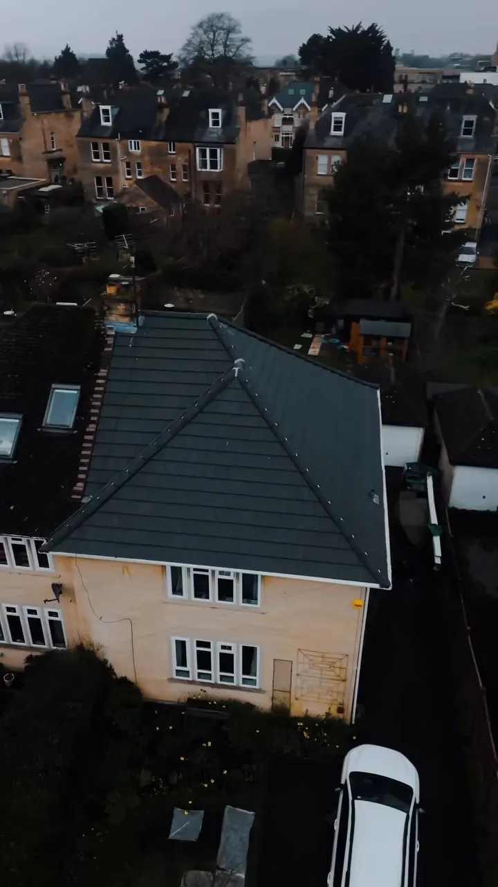 Grey tiled re-roof on a stone house in Bath
