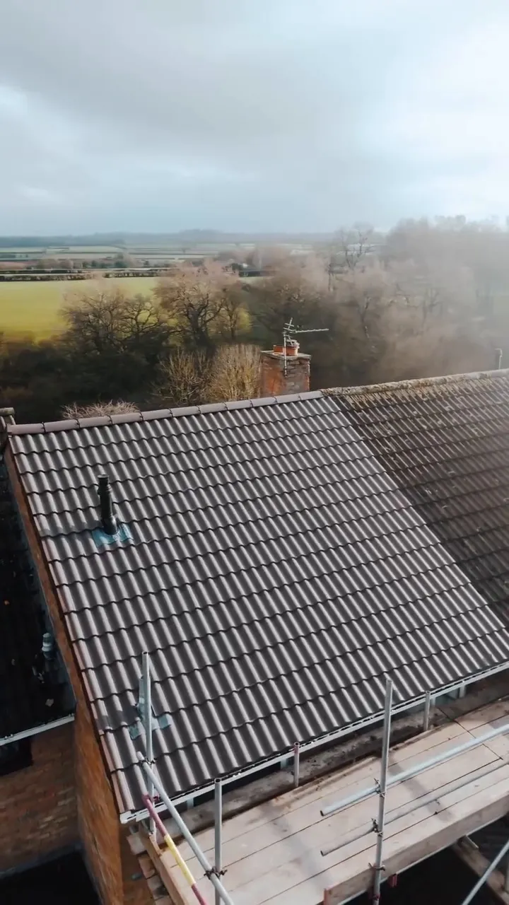 New grey tiles on a Bath roof with countryside beyond