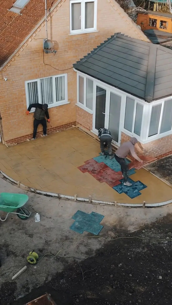 Patio being imprinted with the grand ashlar pattern in Tydd St Giles