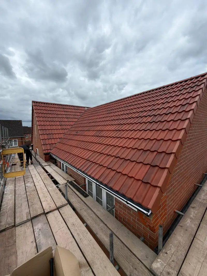 Completed re-roof in red interlocking tiles on a modern home in Bourne, Lincolnshire