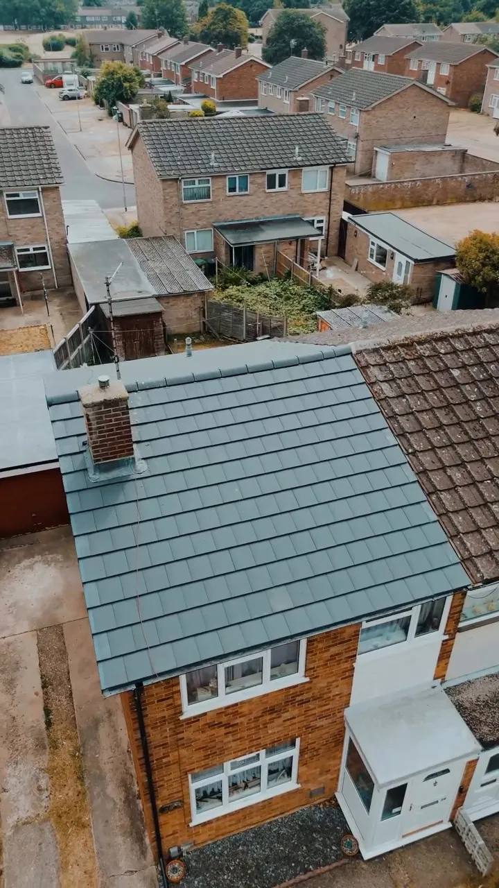 Finished grey tiled re-roof on a semi-detached house in Peterborough