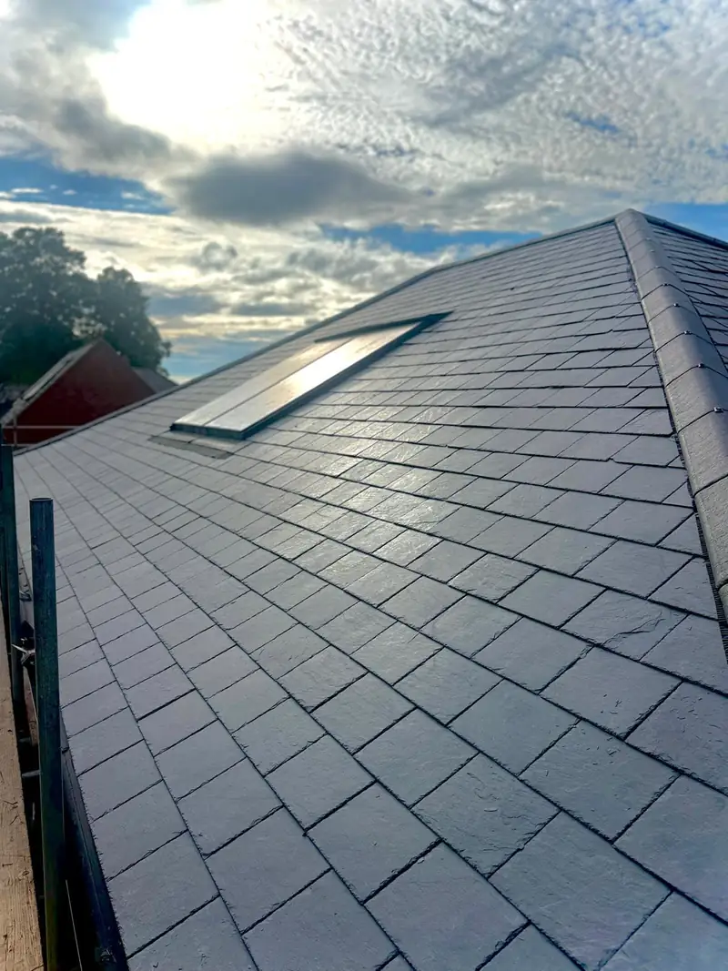 Roof window slated in with new flashings on the Hallaton reroof