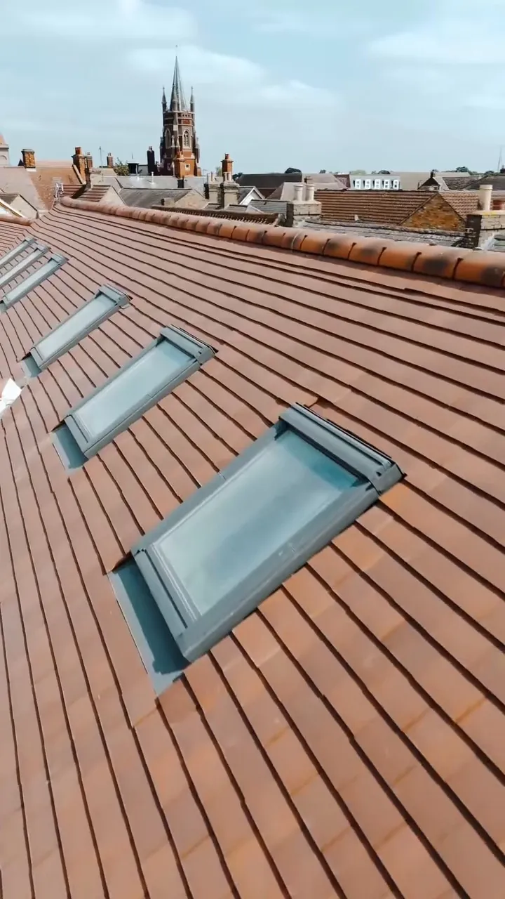 Roof windows set into the clay tile roof on a St Neots new build