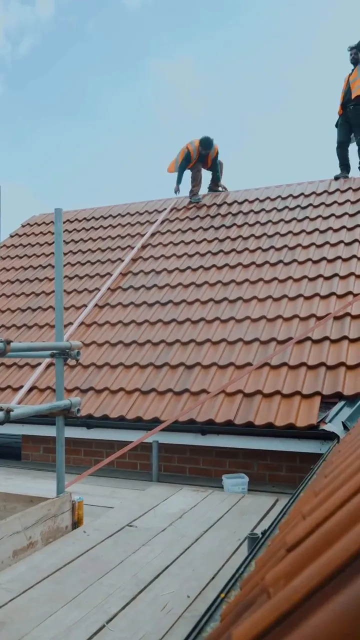 Our roofers tiling the Rustic Red roof in Stamford